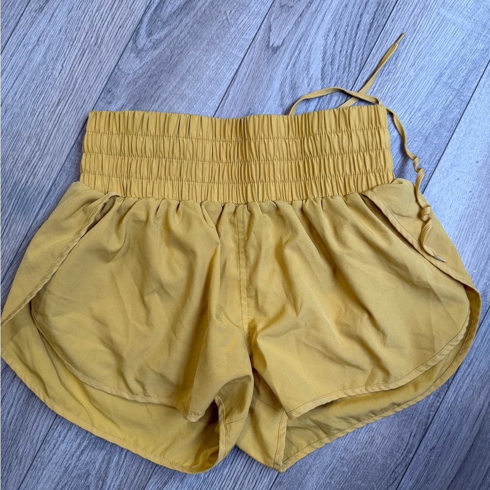 Cara Loren running shorts size SMALL yellow